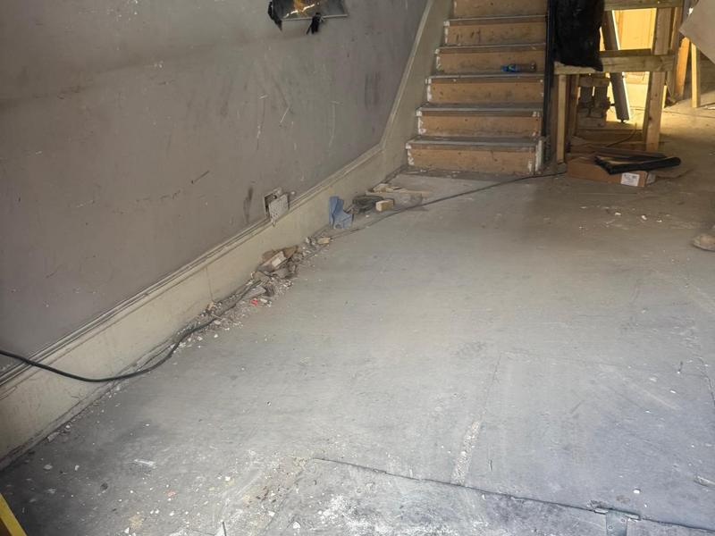 The same unfinished room after the loose renovation waste was removed