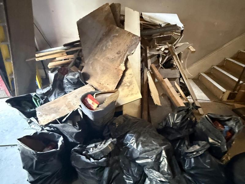 Loose renovation waste in an unfinished room before clearance