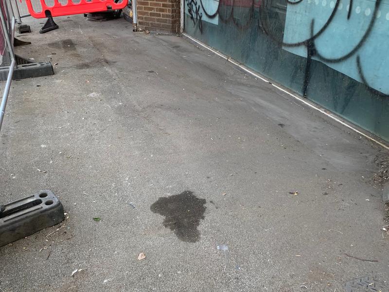 The same covered passage after the dumped waste was removed
