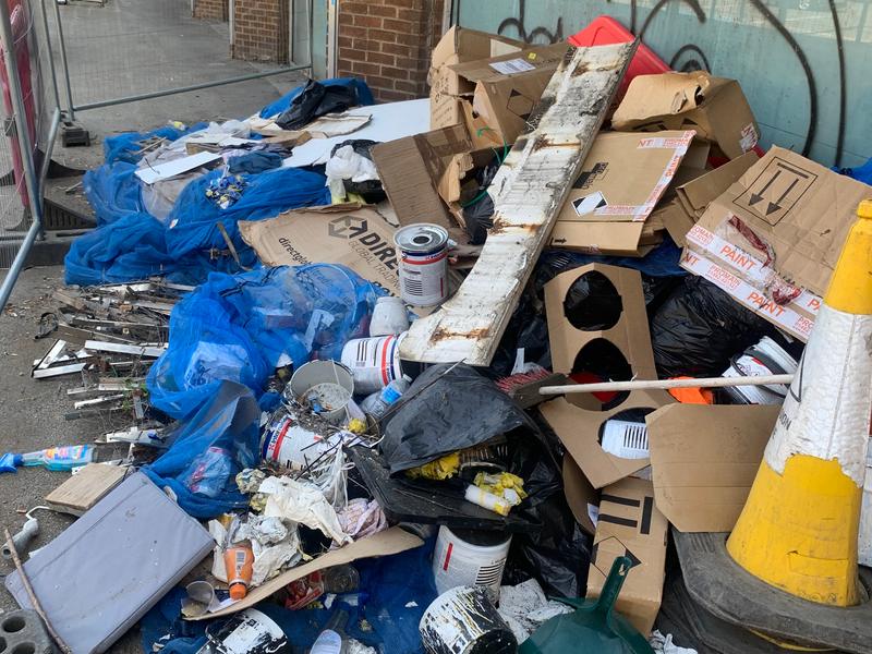 Dumped waste in a covered passage before clearance