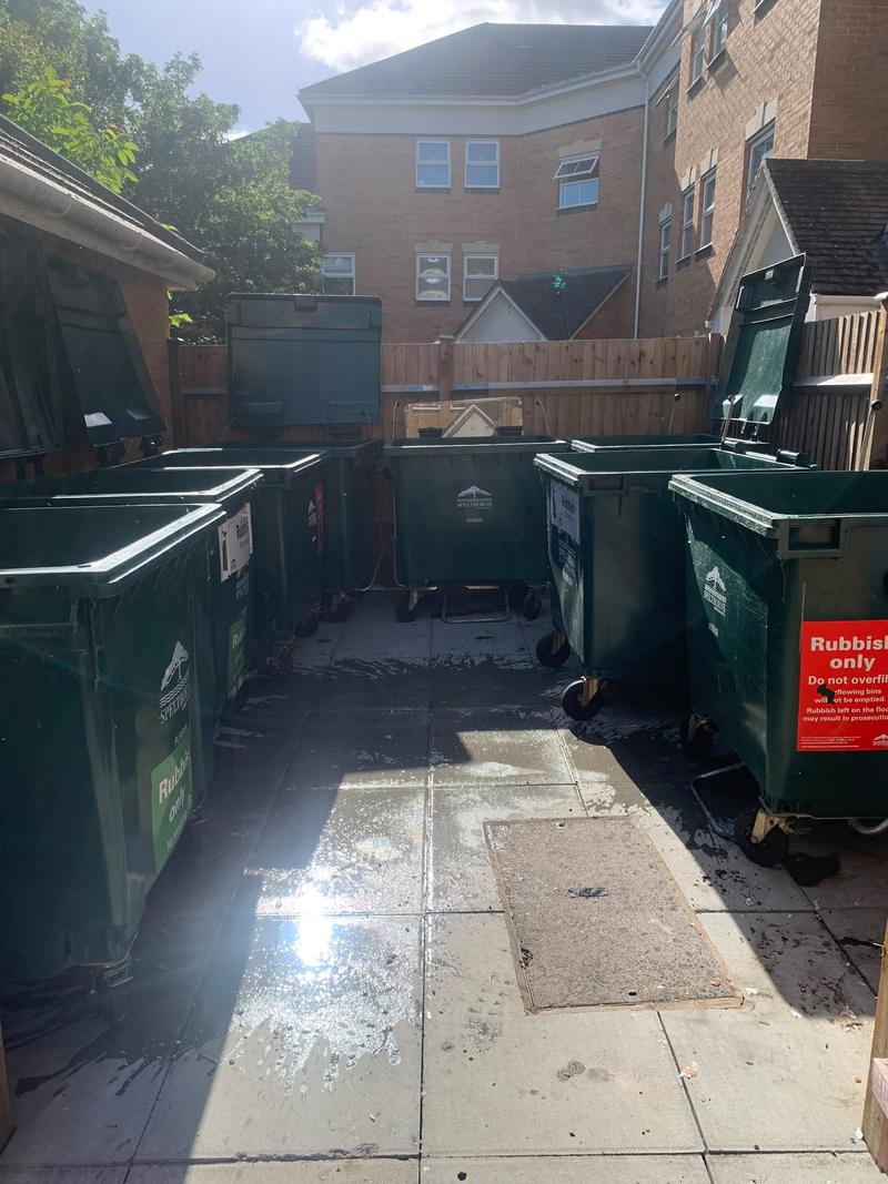 Emptied communal bins with the walkway cleared