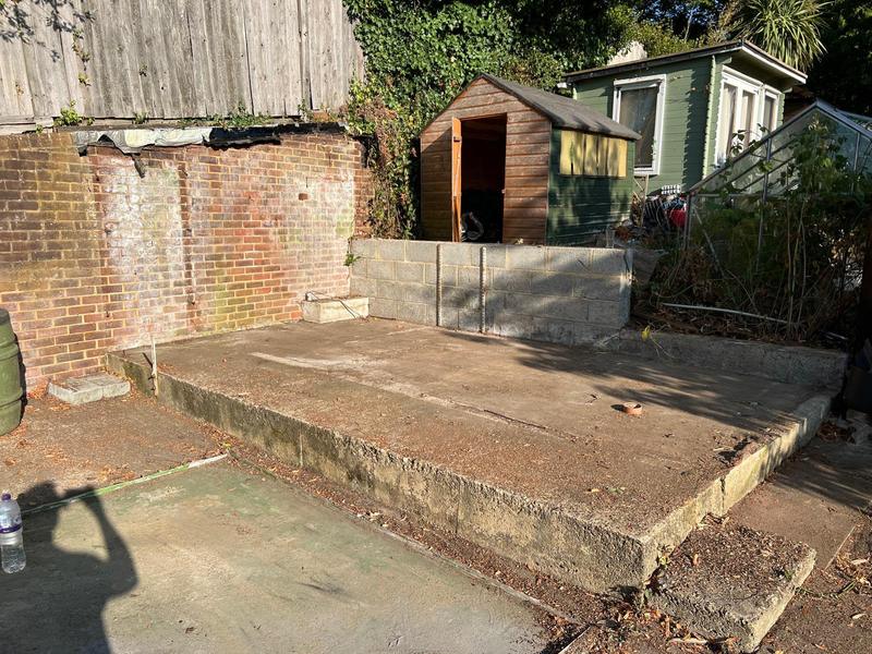 Exposed concrete base after removal of the pictured structure